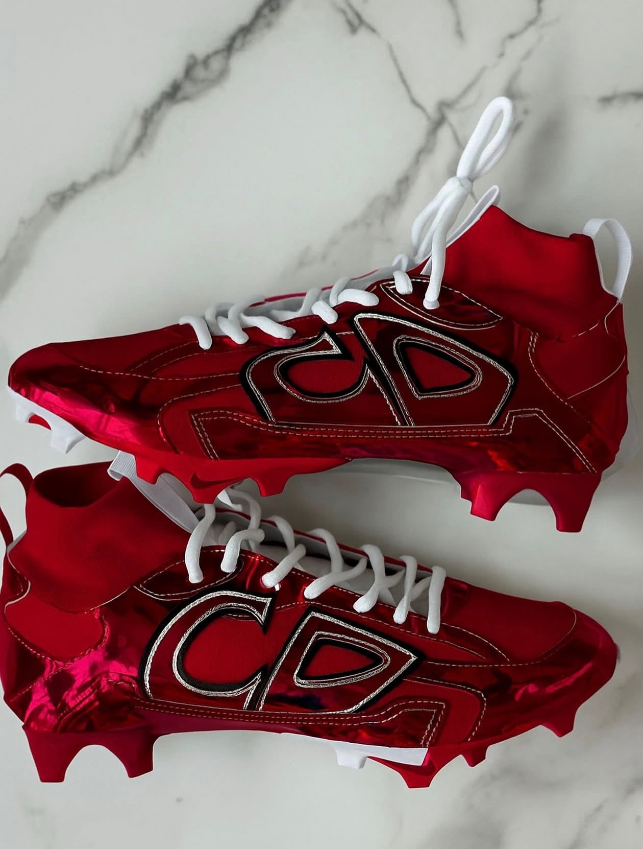 custom Adidas Adizero football cleats with a full chrome red